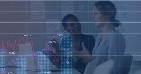 Diverse Female Colleagues Discussing Finance with Graph Overlay