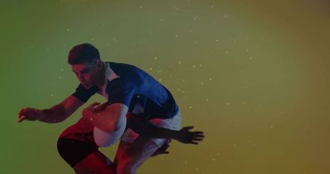 Rugby players in dynamic action against vibrant gradient