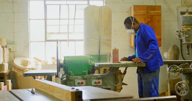 Skilled Carpenter Using Woodworking Machinery in Workshop - Download Free Stock Images Pikwizard.com