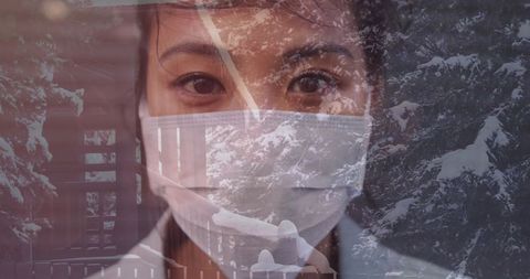 Woman Wearing Face Mask Against Snowy Winter Landscape