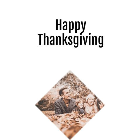 Smiling family enjoying autumn leaves for thanksgiving celebration