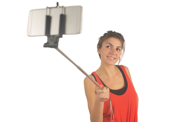 Smiling Young Woman Using Selfie Stick on Transparent Background - Download Free Stock Videos Pikwizard.com