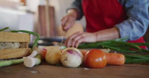 Senior Woman Preparing Fresh Vegetables in Rustic Kitchen - Download Free Stock Images Pikwizard.com