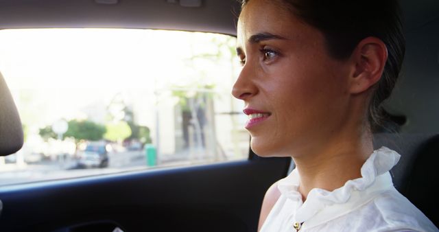 Confident Businesswoman Riding in Car, Bright Day - Download Free Stock Images Pikwizard.com