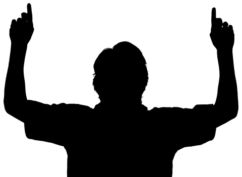 Silhouette of celebratory male footballer hands raised on transparent background