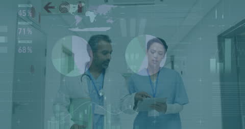 Diverse Doctors Analyzing Digital Data in Hospital Corridor