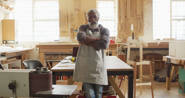 Confident Senior Carpenter in Workshop with Arms Crossed - Download Free Stock Images Pikwizard.com