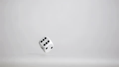 Single Dice Bouncing in Air on Grey Background