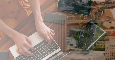 Businesswoman Working on Laptop with Cityscape Overlay