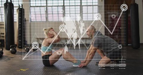 Partner holding feet while performing sit-ups in gym with digital fitness analytics overlay