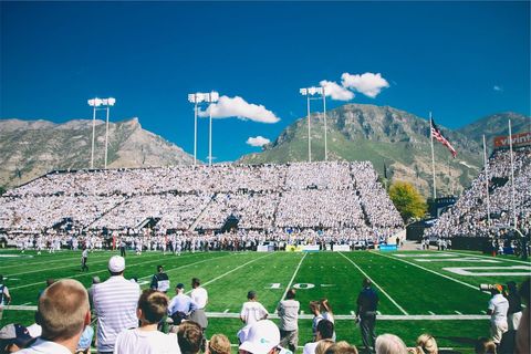 College football crowd cheering during white out at mountain stadium
