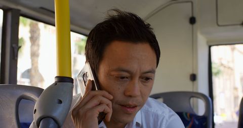 Biracial Man Talking on Smartphone Public Transport Urban Lifestyle - Download Free Stock Images Pikwizard.com