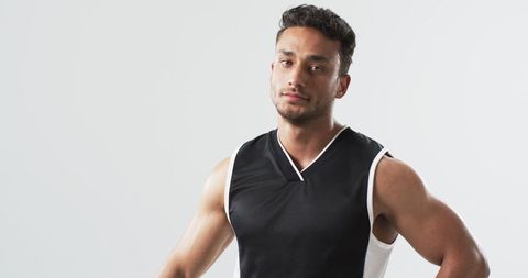 Confident Young Athlete in Sportswear Posing Indoors