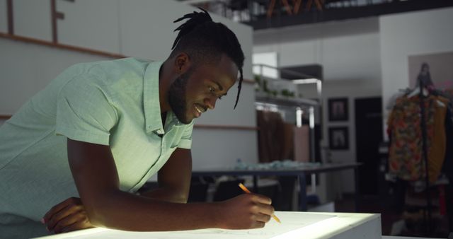 Young Black Man Designing Patterns on Lightbox - Download Free Stock Images Pikwizard.com