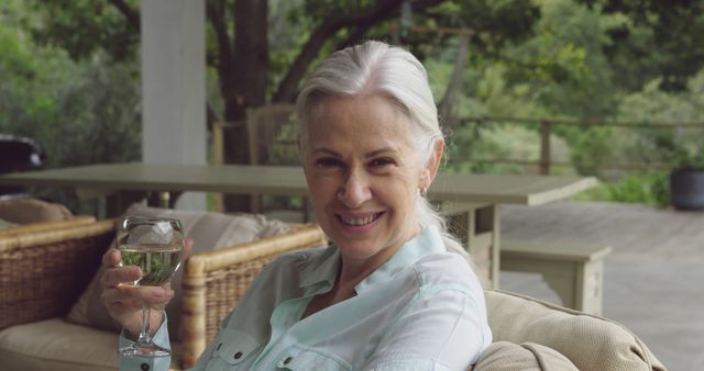 Happy Senior Woman Holding Glass of Wine Outdoors - Download Free Stock Images Pikwizard.com