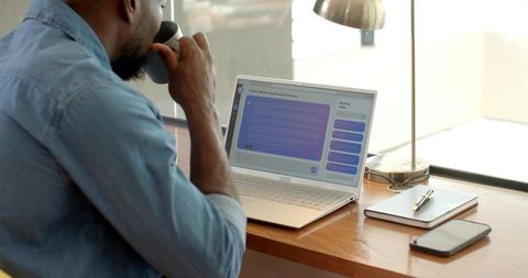 Casual Home Workspace with Thoughtful African American Professional