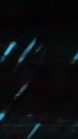 Vertical Loop Featuring Diagonal Neon Streaks Sliding Through Dark Futuristic Tech Scene