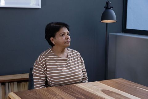 Senior Confident Woman in Scandinavian Inspired Workspace