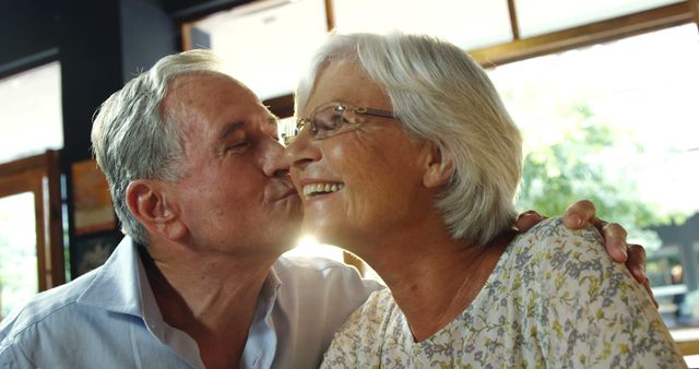 Older Couple Sharing Tender Moment in Sunlit Room - Download Free Stock Images Pikwizard.com