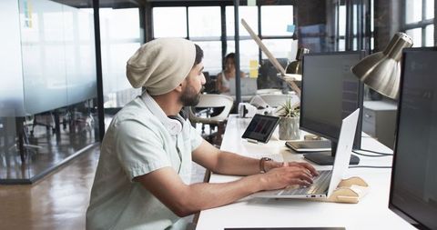 Young innovative developer engaged in creative work environment