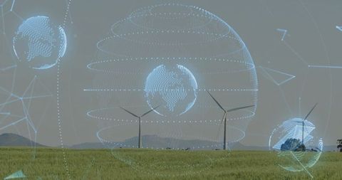 Holographic globes over wind farm signaling future tech in sustainability