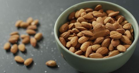 Fresh Almonds in Ceramic Bowl on Gray Surface - Download Free Stock Images Pikwizard.com