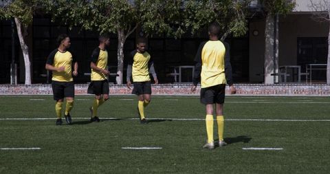 Soccer team preparing for penalty kick on outdoor field