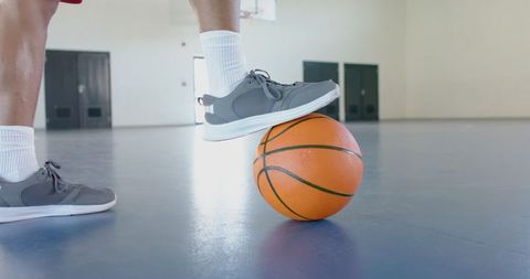 Basketball Player Balancing Ball on Indoor Court Close-Up - Download Free Stock Images Pikwizard.com