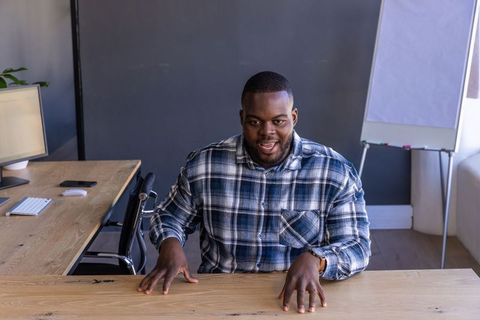 Modern professional at desk in corporate office environment