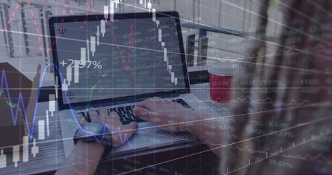 Man Working on Laptop Analyzing Stock Market with Double Exposure of Charts