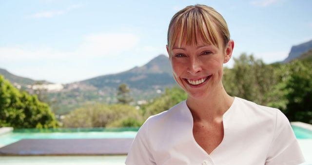 Smiling Woman Relaxing Outdoors Near Pool - Download Free Stock Images Pikwizard.com