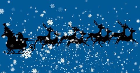 Santa's sleigh with reindeer silhouette in snowy night sky