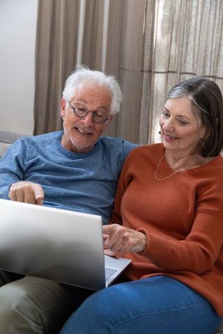 Senior Couple Relaxing Home Lifestyle Using Laptop Together