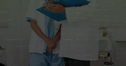 Healthcare Professionals Engaged in Patient Care in Hospital Ward