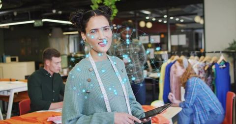 Creative fashion designer leading team in modern studio environment