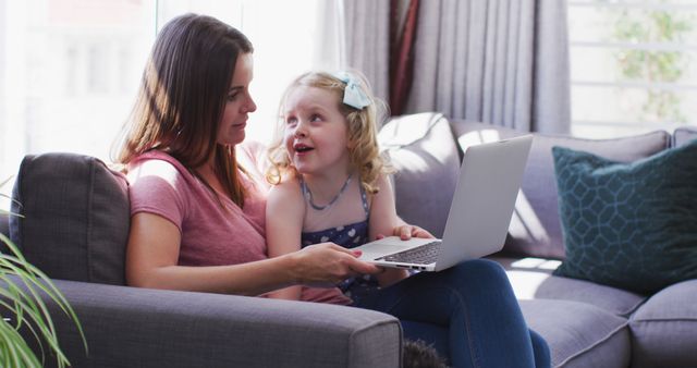 Mother and Daughter Exploring Laptop Together on Couch - Download Free Stock Images Pikwizard.com