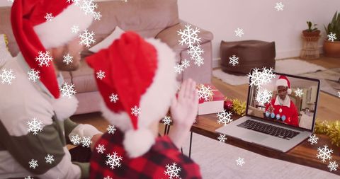 Father and Son Video Calling Family During Christmas Celebration