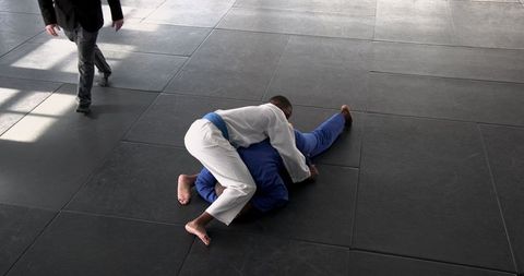 Martial arts grappling training in dedicated facility