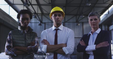 Confident Warehouse Team Leaders in Industrial Setting - Download Free Stock Images Pikwizard.com