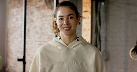 Athletic woman in minimalist gym environment