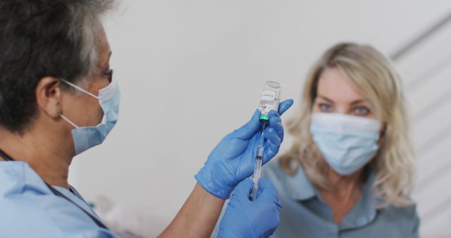 Medical Professional Administering Vaccine to Patient in Flexible Clinic - Download Free Stock Images Pikwizard.com