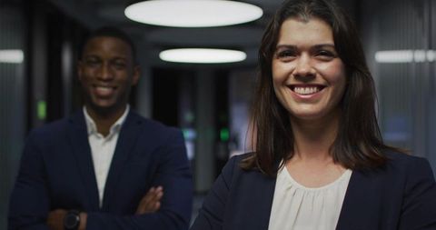 Confident Businesswoman Standing in Modern Office Corridor