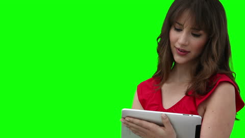 Woman Using Tablet for Work or Learning on Green Screen