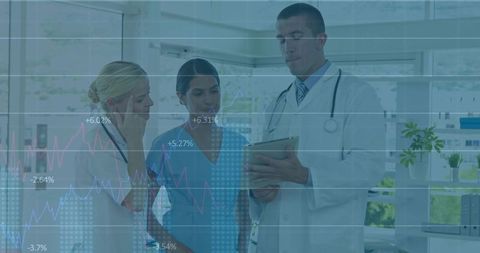 Medical team reviewing tablet with healthcare analytics dashboard overlay in bright clinic