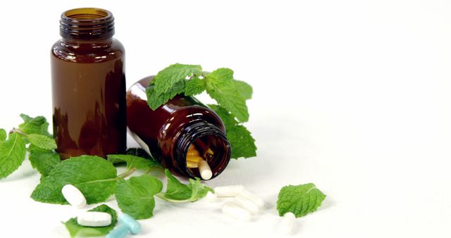 Brown Bottles with Pills and Fresh Mint on White Background - Download Free Stock Images Pikwizard.com