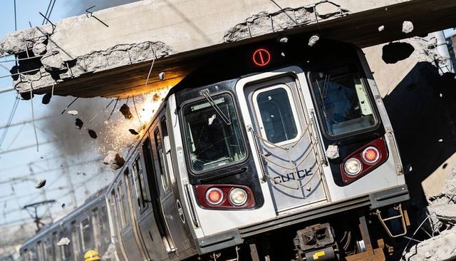 Subway train crashing under collapsed overpass, sparks and concrete debris flying