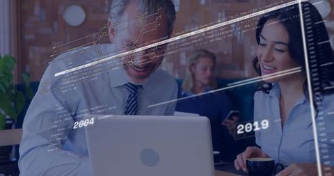 Business Professionals Enjoying Modern Technology in Coffee Shop