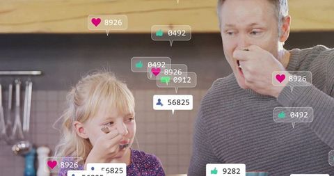 Father and daughter enjoying meal with social media elements