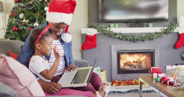 Mother and Daughter Celebrating Christmas by Video Call with Laptop - Download Free Stock Images Pikwizard.com