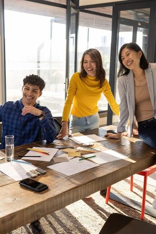 Diverse Team Collaborating on Design Project in Modern Office